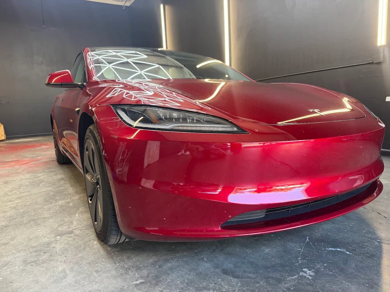 Tesla finished in a deep red color-change wrap